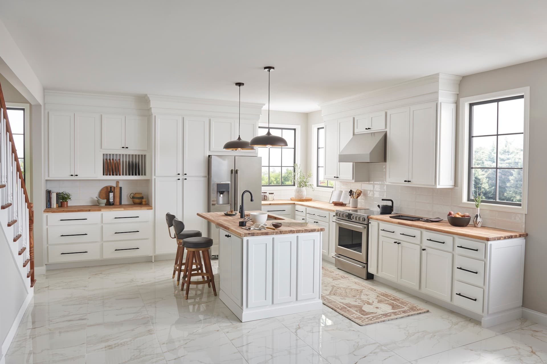 Classic white kitchen with shaker cabinets and butcher block countertops